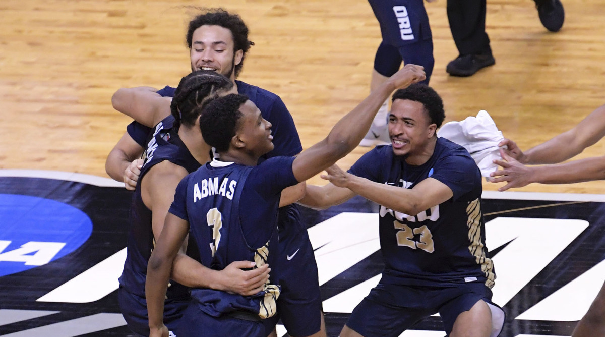 Oral Roberts Golden Eagles celebrate their 81-78 victory over the Florida Gators during the second round of the 2021 NCAA Tournament on Sunday, March 21, 2021,